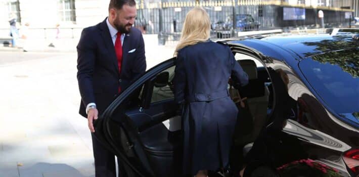 Lisbon limousine chauffeur opening door